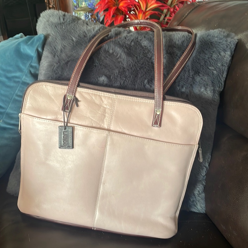 Pink with brown straps Latino computer bag.